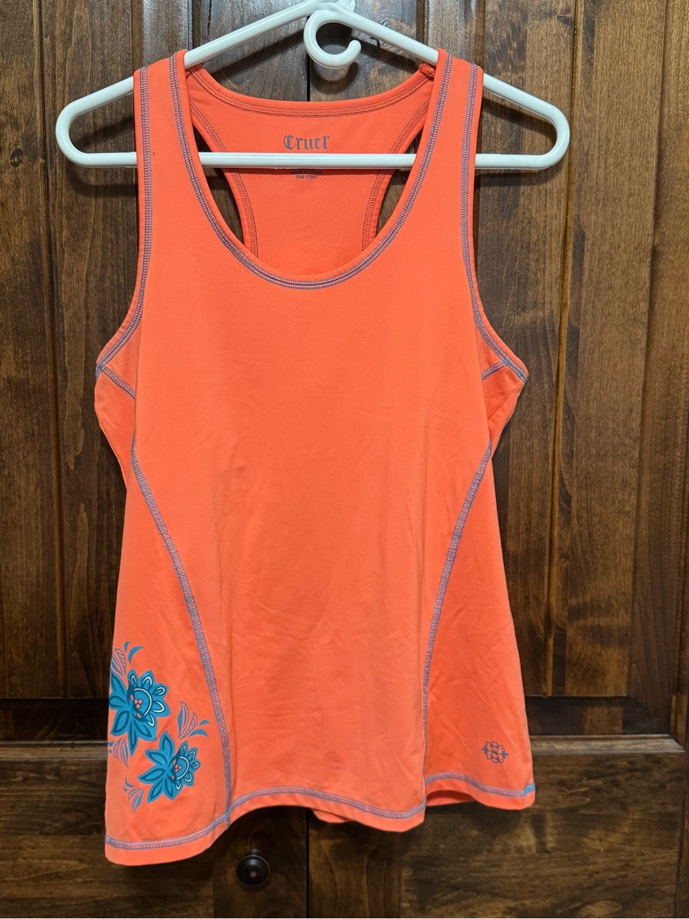 Cruel Girl Orange Racerback Tank with Blue Floral Accent